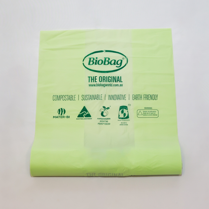 Roll of green 10L compostable bag with BioBag branding on a light gray background