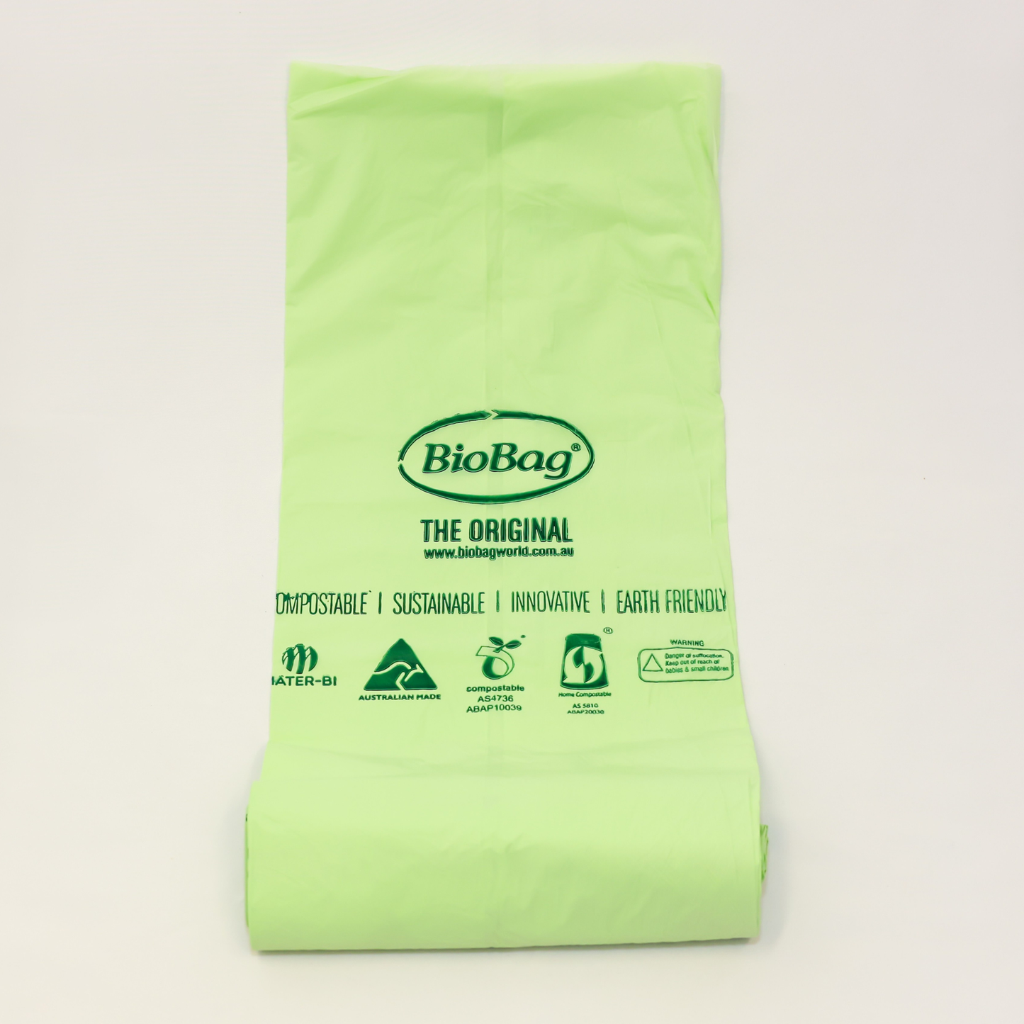 Green Biobag on a light gray background with the Australian made logo, and compostable certification logos