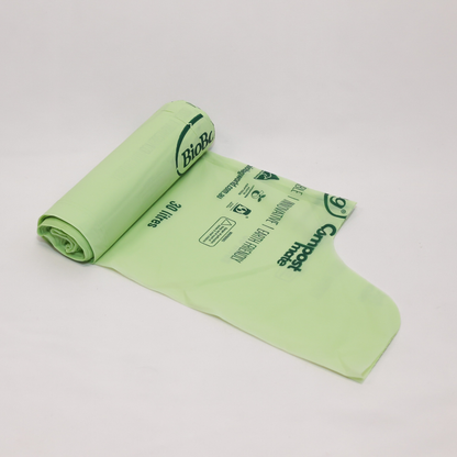 Roll of green 30L compostable bags with BioBag branding on a white background
