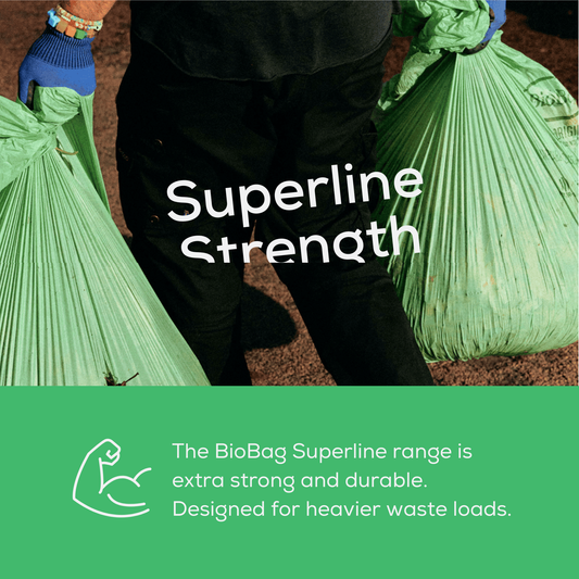 Person carrying full compostable bin bags with the brand Superline Strength and text about how strong and durable the BioBag Superline range is. 