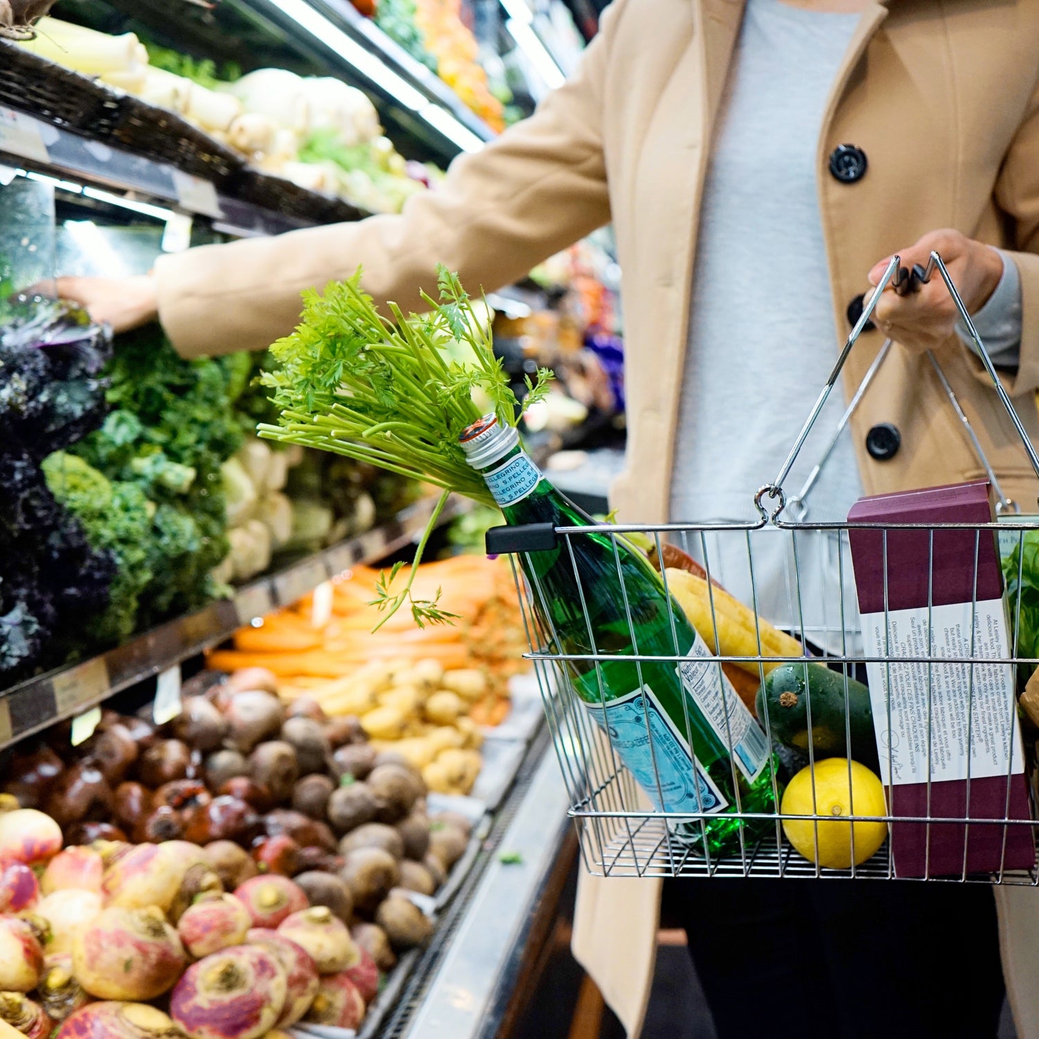 Person in a supermarket with a basket of organic ingredients